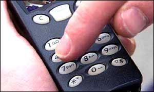 Man punching number into keypad