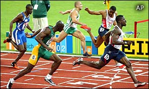 Dwain Chambers crosses the finish line to win the gold medal