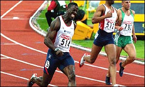 Great Britain's Dwain Chambers celebrates winning the Mens 100m final 