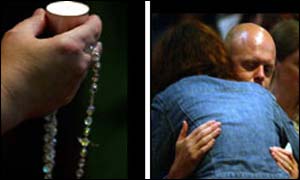 Holly's father Kevin Wells is comforted by friends