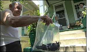 Man shows dead bird at his home in Louisiana