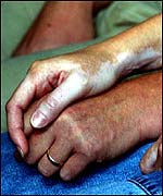 Kevin and Nicola Wells holding hands