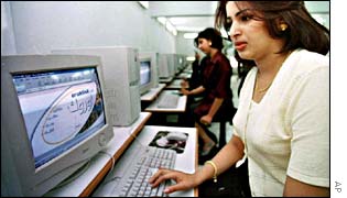 Woman surfs the internet in a Baghdad cafe