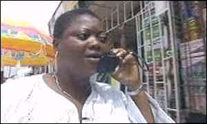 Lagos market trader on the phone