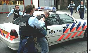 Police arresting Volkert van der Graaf