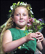 Girl in flower ceremony - part of crowning 