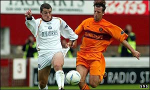 Thistle's Jamie Buchan challenges Dirk Lehmann