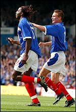 Portsmouth's Vincent Pericard is congratulated by Nigel Quashie after scoring 