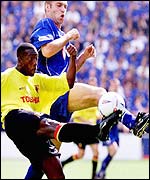 Watford's Neil Cox is tackled by Jamie Scowcroft.