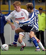 Bjarni Gudjonsson (left) goes past Sheffield Wednesday's Simon Donnelly. 