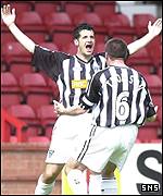 Steve Crawford celebrates the opening goal with Scott Thomson
