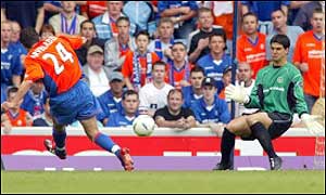 Goals from Ronald de Boer, Shota Averladze and Peter Lovenkrands give Rangers an easy 3-0 win over Dundee