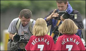 TV camera crews capture the reconstruction