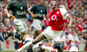 Steven Gerrard receives an early booking after this wild challenge on Vieira