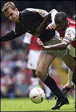 Dietmar Hamann of Liverpool clashes with Patrick Vieira 