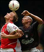 Arsenal's Dennis Bergkamp (left) and El Hadji Diouf of Liverpool