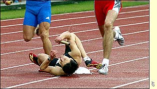 Germany's Jens Dautzenberg takes a tumble during the men's 4x400m relay