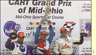 Patrick Carpentier celebrates victory in the Cart Mid-Ohio Grand Prix 