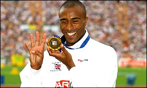Colin Jackson salutes his win in the 110 hurdles