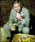 Prince Charles eats cheese at Scottish Crannog Centre