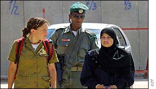 Intisar Ajouri is escorted into a military court at Beit El