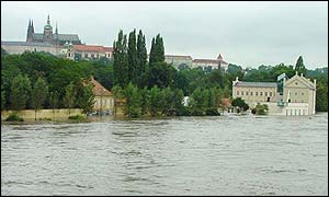 Water floods an art gallery beneath the Hradcany castle