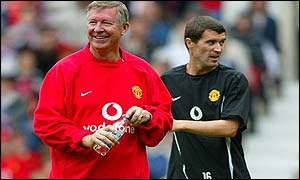 Sir Alex Ferguson (foreground) with Keane during a training session