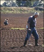 People with metal detectors