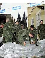 Soldiers sandbagging roads in the Old Town section of Prague