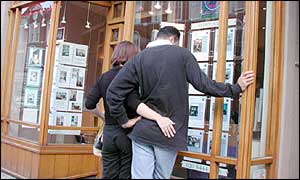 young couple looking at houses
