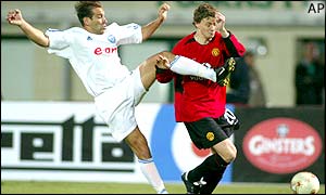 Ole Gunner Solskjaer is challenged by Zalaegerszeg's Babati Ferenc during their Champions League qualifying match in Budapest, Hungary