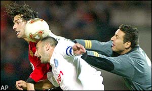 Zalaegerszeg's Sasa Ilic (right) and Florian Urban go on the defensive as United's Ruud van Nistelrooy attacks the home goal
