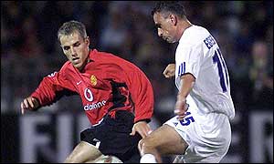 Phil Neville battles for the ball with Gabor Egressy of Zalaegerszeg 