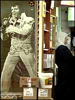 A woman stands at the Elvis Inn outside Jerusalem where fans are expected to gather