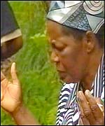 Herve Bola grandmother prays for his soul at the pool where he drowned