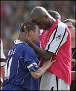 Patrick Vieira (right) squares up to Dennis Wise