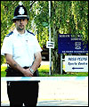 Police officers seal off the area around Soham Village College