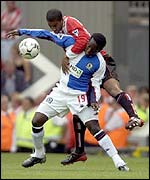 Blackburn's Dwight Yorke and Sunderland's Phil Babb compete for the ball