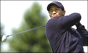 Tiger Woods tees off at the first
