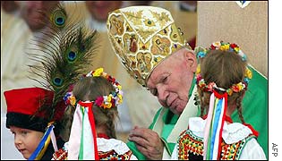 Pope welcomed by girls in traditional costume