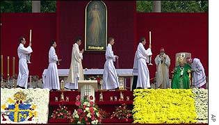 Pope (seated right) attends mass