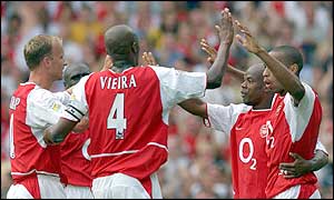 Arsenal players celebrate Sylvain Wiltord's goal