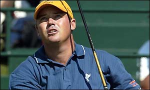 Rich Beem drives at the 11th hole