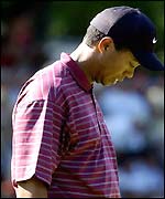 Tiger Woods looks disconsolate after a bogey on the 13th hole