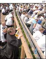 Worshippers kneel to pray