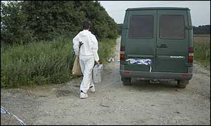 A forensic officer on his way to the scene near Mildenhall, Suffolk
