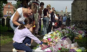 Local people view flowers at St andrew's Church in Soham