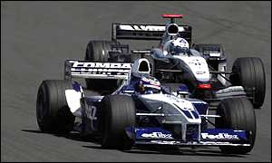 Juan Pablo Montoya and David Coulthard fight for track position at the Nurburgring