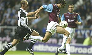 West Ham's Christian Dailly beats Newcastle striker Alan Shearer to the ball