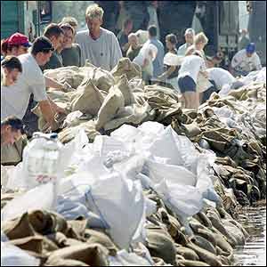 Residents and volunteers pile up sandbags near Magdeburg, in Germany. AP